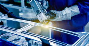 Workers,In,The,Car,Manufacturing,Workshop,Are,Using,Professional,Machines